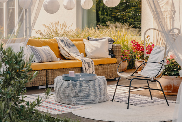 Outdoor curtains in cozy backyard deck area.